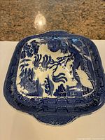Top view of lidded dish showing Blue Willow pattern