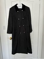 Full front view of the wool coat on hanger