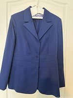 Front view of royal blue blazer on hanger