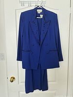 Full view of jacket and skirt on hanger