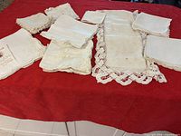 All linen sets and table runner displayed on red background