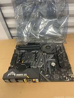 Top view of ASUS TUF Gaming X570-Plus Wi-Fi motherboard showing socket, chipset heatsink, DIMM slots