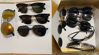 Overview of six sunglasses on white background, shows variety of styles and lenses