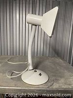 Full view of white metal desk lamp showing gooseneck and base