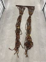 Full view of entire multi-strand wood bead curtain laid out