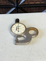 Front view of Ames 516S dial thickness gauge showing dial face and frame