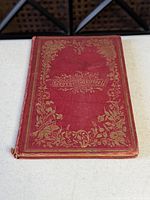Front cover showing maroon cloth and gilt decoration