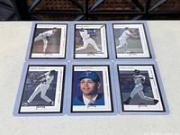 All six Fleer Premium cards in top loaders