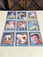 Full 3x3 layout of all nine sleeved cards