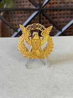 Front view showing complete design of ROTC badge