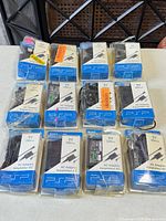 All twelve sealed Sony PSP AC adapters displayed
