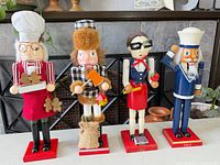Front view of all four nutcrackers on bases