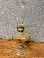 full view of lamp front showing chimney, burner, glass font and base