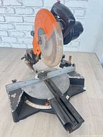 Full view of Chicago Electric sliding compound miter saw showing blade guard, base and slide rails