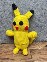 Full view of crocheted Pikachu plush