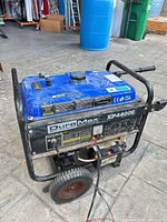 Front view showing DuroMax XP4400E control panel, wheels, battery leads