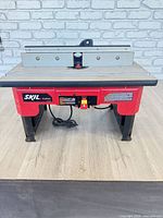 Front view showing entire Skil RAS900 table router, power switch and legs