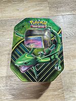 Closed Rayquaza Pokémon tin showing artwork and window
