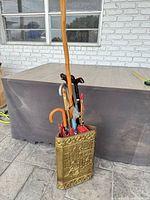 Full view of umbrella stand with contents