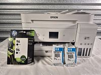 Front view of Epson ET-4760 printer with ink cartridges displayed