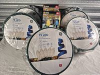 Five sealed GE StayBright reels plus box of stakes