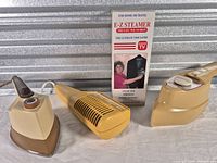 Full view of three appliances: Sunbeam iron, Northern styler/dryer, E-Z Steamer box