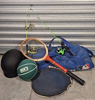 All items grouped: tennis racket, fishing rod & reel, bats, duffel bag, basketball, cover, lures