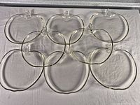All eight apple-shaped glass platters laid out to show complete set