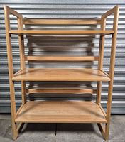 front view of entire folding bookshelf showing three shelves