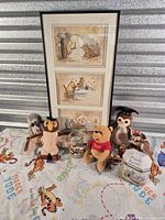 Entire assortment of framed art, plush toys, tin, glass and figurines displayed together