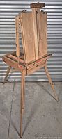 Full view of wooden tripod easel extended