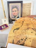 Group view showing needlepoint, map, bust, ornament box, document