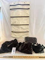 Front view showing organizer, clothing pieces, pouch, scale