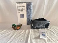 Overall lot showing sealed duvet set, toiletry pouch, wooden duck