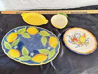 Four lemon motif dishes: oval platter, oval lemon dish, small lemon bowl, scalloped fruit plate