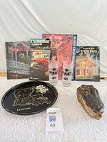 Group shot showing books, glasses, tray, alligator head