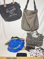 Overview of lot showing all bags, pouches, hat and wallet