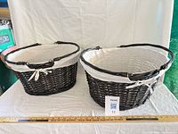 Both baskets side by side with ruler for scale