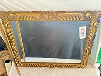 Full view of rectangular gilt mirror