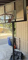 Full view of hoop, pole and base under carport