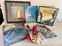 Full lot including books, framed print, tie, and cars