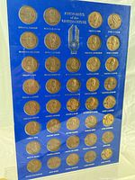 Full view of acrylic-framed board showing all presidential coins