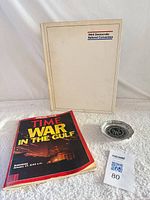 Group shot showing all three items: DNC book, TIME magazine, Watergate ashtray