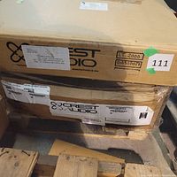 Two Crest Audio amplifier cartons on pallet with model labels visible