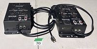 Two Pulsar Mini Pack dimmer units showing top connectors and attached power cords