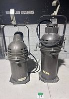 Front view of both Altman ellipsoidal fixtures showing housings and mounting hardware