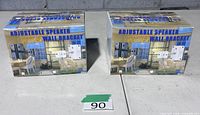 Two retail boxes labeled Adjustable Speaker Wall Bracket model SWB-101, lot of three brackets