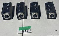 Four inline switch boxes showing XLR ends and on/off switches