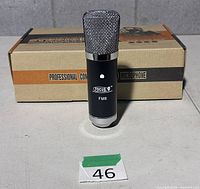 Microphone standing in front of retail box