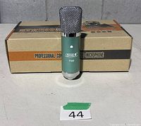 Microphone standing in front of retail box